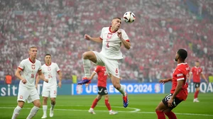 (AP Photo/Ebrahim Noroozi) : Poland's Pawel Dawidowicz heads the ball during a Group D match between Poland and Austria at the Euro 2024 soccer tournament in Berlin, Germany, Friday, June 21, 2024. 