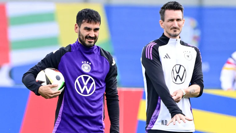 Gundogan (L) cannot wait to lead Germany out on Friday - null