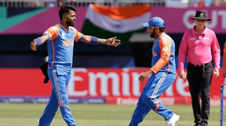 India's Hardik Pandya, left, celebrates with captain Rohit Sharma the dismissal of Pakistan's Shadab Khan during the ICC Men's T20 World Cup cricket match between India and Pakistan at the Nassau County International Cricket Stadium in Westbury, New York. - Photo: AP/PTI