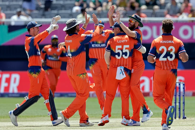 The Netherlands celebrates after outing South Africa's Quinton de Kock during an ICC Men's T20 World Cup cricket match at the Nassau County International Cricket Stadium in Westbury, New York, Saturday, June 8, 2024.
 - . (AP Photo/Adam Hunger)

