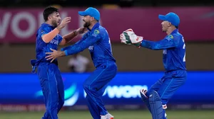 (AP Photo/Ramon Espinosa)
 : Afghanistan's Fazalhaq Farooqi, left, celebrates the dismissal of New Zealand's Daryl Mitchell during an ICC Men's T20 World Cup cricket match at Guyana National Stadium in Providence, Guyana, Friday, June 7, 2024. 