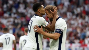 Harry Kane and Jude Bellingham celebrate on Sunday against Slovakia.