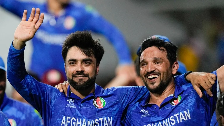 Rashid Khan (left) and Gulbadin Naib celebrate Afghanistan's win over Bangladesh and their semi-final berth at ICC T20 World Cup 2024, in Saint Vincent on Tuesday (June 25). - AP/Ricardo Mazalan