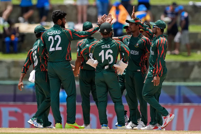 Bangladesh's Rishad Hossain, second left, celebrates with teammates after the dismissal of India's Rishabh Pant during the ICC Men's T20 World Cup cricket match between India and Bangladesh at Sir Vivian Richards Stadium in North Sound, Antigua and Barbuda, Saturday, June 22, 2024. 
 - (AP Photo/Lynne Sladky)