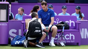 Andy Murray receives treatment at Queen's