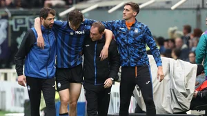 Giorgio Scalvini is helped from the field by Atalanta's medical staff