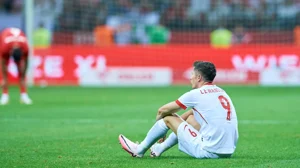 Poland striker Robert Lewandowski goes down injured