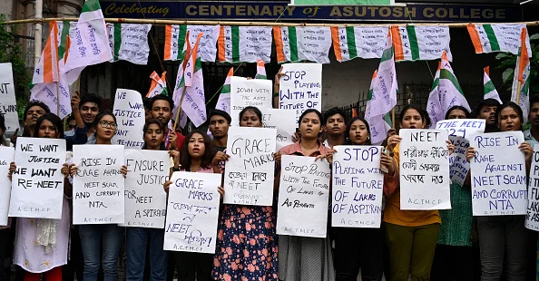 Trinamool Chhatra Parishad (TMCP), students wing of All India Trinamool Congress (TMC) supporters staged a protest against recent scam in NEET and UGC-NET exam in front of Asutosh College, on June 22, 2024 in Kolkata, India. -  (Photo by Samir Jana via Getty Images)
