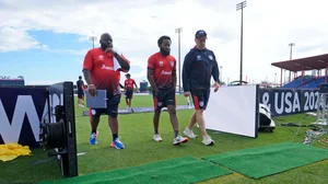 AP : United States' Aaron Jones, centre, walks with team members before their ICC Men's T20 World Cup match against Ireland at the Central Broward Regional Park Stadium in Lauderhill, Fla. on June 14, 2024.