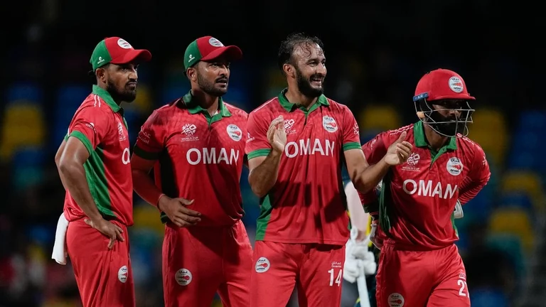 Oman's Mehran Khan, second right, celebrates after taking the wicket of Australia's Glenn Maxwell during an ICC Men's T20 World Cup cricket match at Kensington Oval in Bridgetown, Barbados, Wednesday, June 5, 2024.  - (AP Photo/Ricardo Mazalan)