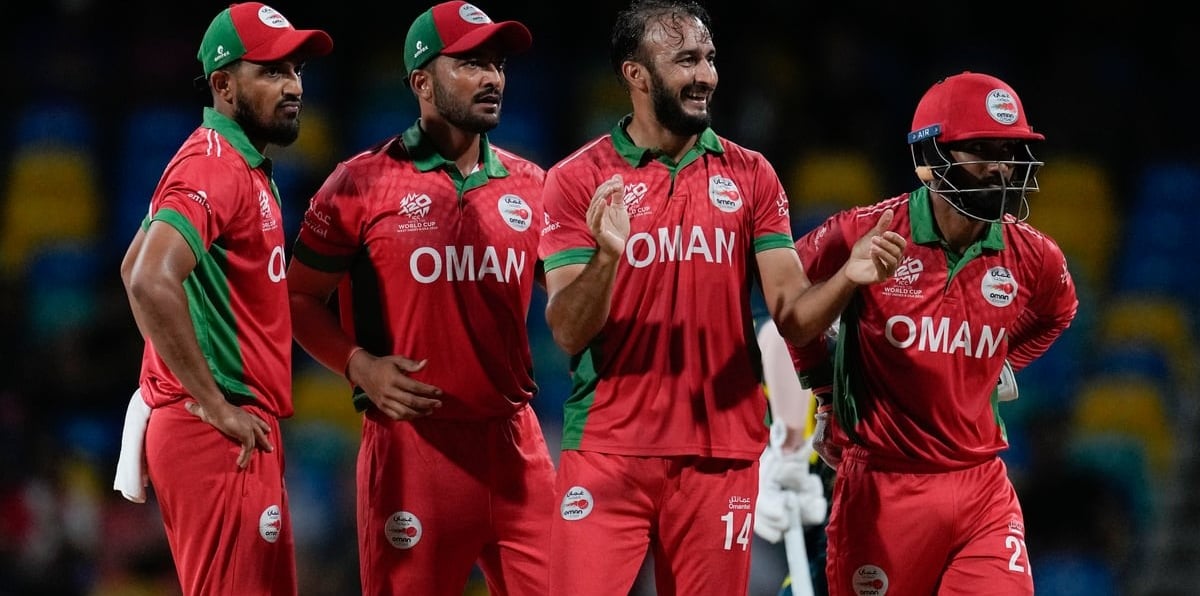 (AP Photo/Ricardo Mazalan) : Oman's Mehran Khan, second right, celebrates after taking the wicket of Australia's Glenn Maxwell during an ICC Men's T20 World Cup cricket match at Kensington Oval in Bridgetown, Barbados, Wednesday, June 5, 2024. 