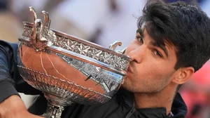 AP/Christophe Ena : Spain's Carlos Alcaraz kisses the trophy after winning the men's final of the French Open tennis tournament against Germany's Alexander Zverev at the Roland Garros stadium in Paris, France, Sunday, June 9, 2024.

