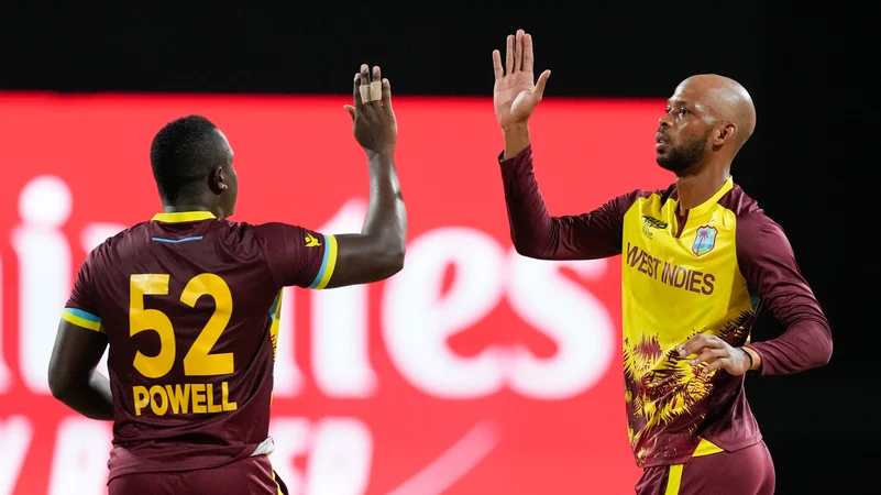 Rovman Powell and Roston Chase. AP Photo