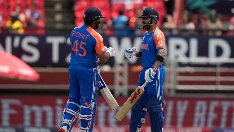 Indias captain Rohit Sharma, left, and Virat Kohli celebrate scoring runs. AP PTI