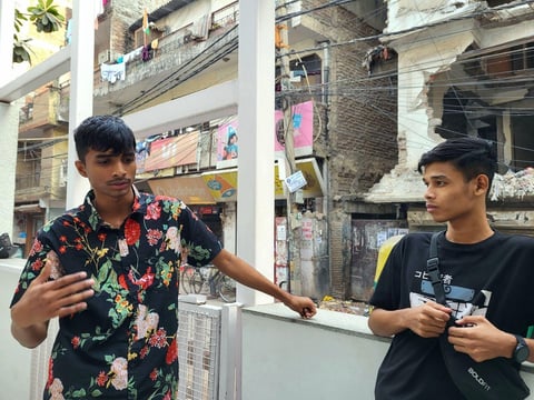 Shivam and Shivek (left to right) stand outside of Khoj Studios to discuss in detail their admiration for Jaun Eliya and the process of writing