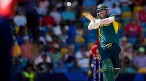 AP Photo/Ricardo Mazalan : Australia's David Warner hits for four runs against England during an ICC Men's T20 World Cup cricket match at Kensington Oval in Bridgetown, Barbados.
