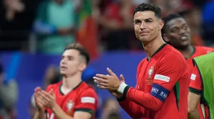  (AP Photo/Matthias Schrader) : Portugal's Cristiano Ronaldo applauds after a round of sixteen match between Portugal and Slovenia at the Euro 2024 soccer tournament in Frankfurt, Germany, Monday, July 1, 2024.