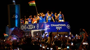 `Dinesh Parab/Outlook : Indian players aboard bus during their victory parade in Mumbai