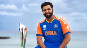 Photo: X/ @BCCI : Rohit Sharma posing with the ICC T20 World Cup 2024 trophy in Barbados.