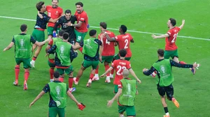(AP Photo/Michael Probst) : Portugal players celebrate their win against Slovenia during a round of sixteen match between Portugal and Slovenia at the Euro 2024 soccer tournament in Frankfurt, Germany, Monday, July 1, 2024. 