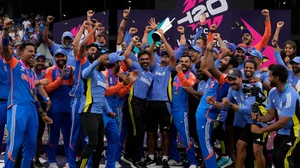 AP Photo/Ricardo Mazalan : India's head coach Rahul Dravid, centre, and players celebrate with the winners' trophy after defeating South Africa in the ICC Men's T20 World Cup final cricket match at Kensington Oval in Bridgetown, Barbados.