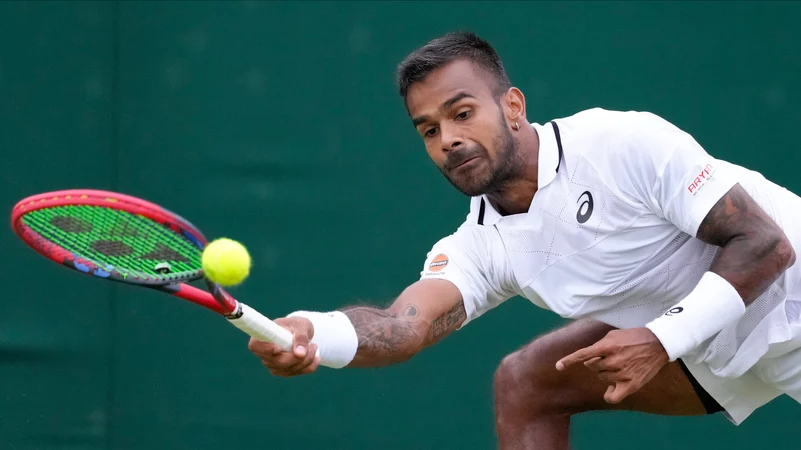 Sumit Nagal of India plays a forehand return 