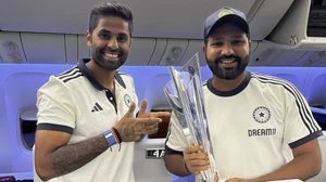 PTI : T20 WC winning captain Rohit Sharma (Right) poses with the trophy alongside Suryakumar Yadav.