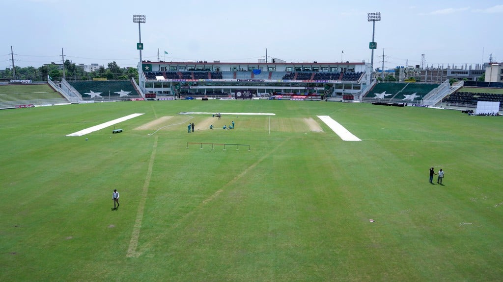 Ground staff work to prepare pitch for first cricket test match between Pakistan and Bangladesh, in Rawalpindi, Pakistan.