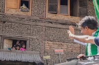 | Photo: AP/Mukhtar Khan : J&K Assembly Polls: PDP candidate right Arif Laigroo waves towards people during a road show 