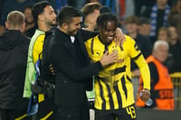 | Photo: AP//Omar Havana : UEFA Champions League, Club Brugge vs Borussia Dortmund: Dortmund's head coach Nuri Sahin embraces match winner Jamie Gittens