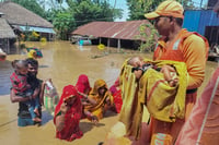 | Photo: PTI : Bihar Floods: NDRF personnel conduct a rescue operation in Supaul district