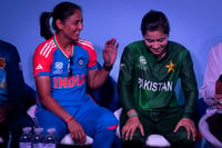 | Photo: AP/Altaf Qadri : Women's T20 World Cup, Captains' Day: Harmanpreet Kaur, left, shares a laugh with Pakistan captain Fatima Sana 