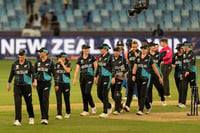 | Photo: AP/Altaf Qadri : Women's World T20 Cricket, India vs New Zealand: New Zealand team members walk back after they beat India