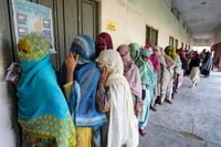 | Photo: PTI/Kamal Kishore : Haryana Assembly elections: Voters wait in a queue to cast their votes in Nuh district