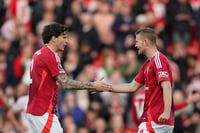 | Photo: AP/Dave Thompson : EPL 2024-25: Manchester United's Victor Lindelof, left, and Matthijs de Ligt celebrate at the end of the match