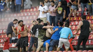 Fans clash during a Mexican soccer league match between the host Queretaro and Atlas on Saturday.