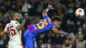 Barcelona's Pierre-Emerick Aubameyang, right, vies for the ball with Galatasaray's Marcao.
