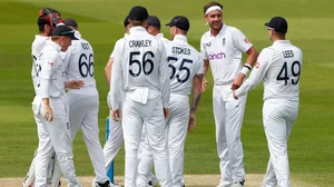 England players celebrate the fall of an New Zealand wicket at Lord's. 