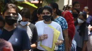 Students waiting in a queue. 