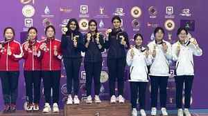 India's women’s junior air pistol team posing with their medals in Cairo.