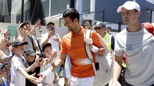 Djokovic, centre, with Pospisil for his doubles match at the Adelaide International on Monday.