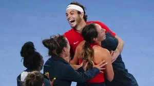 USA's Taylor Fritz celebrates with his teammates after defeating Berrettini on Sunday.