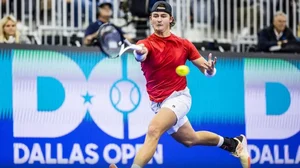 Wolf returns a forehand against Tiafoe in the Dallas Open quarterfinals on Friday.