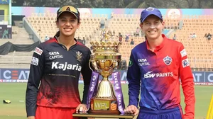 Mandhana and Lanning pose with the WPL trophy on Sunday.