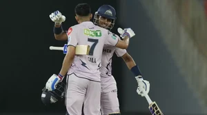 Gill is congratulated by team-mate Dasun Shanaka after reaching his hundred on Monday.