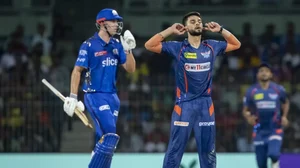 Naveen-ul-Haq celebrates a wicket of MIs Cameron Green during the Eliminator match.