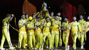 Players of Chennai Super Kings celebrate with the winners trophy.