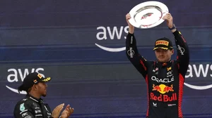 Verstappen celebrates his win in Barcelona as second-placed Hamilton applauds.