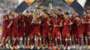 Spain players celebrate with the trophy after winning the Nations League final.