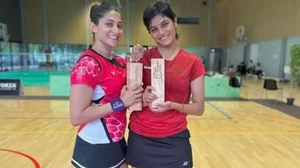 Ponnappa, left, and Crasto pose with their title on Monday.